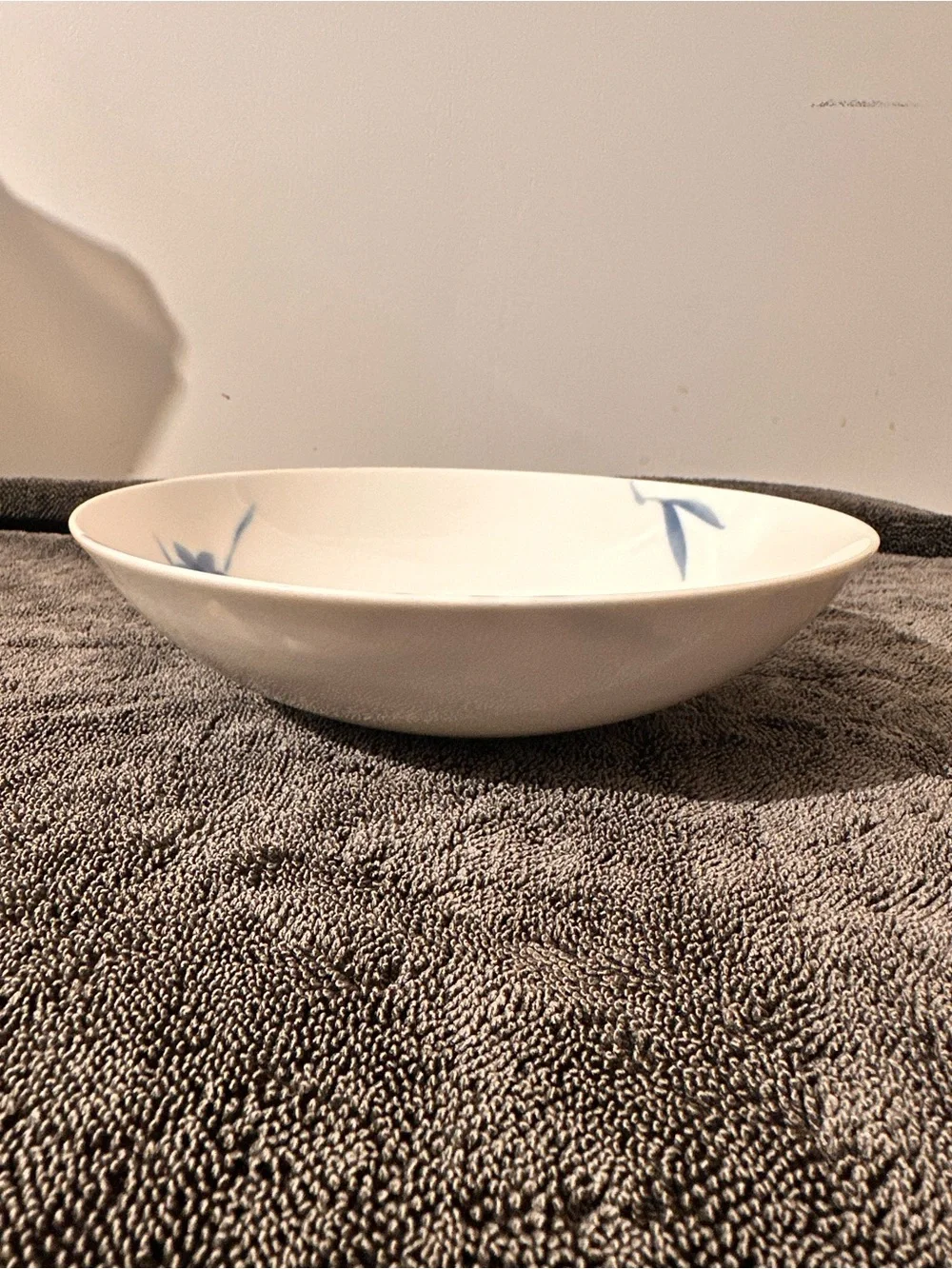 White Porcelain Dinner Plate with Blue Floral Accent